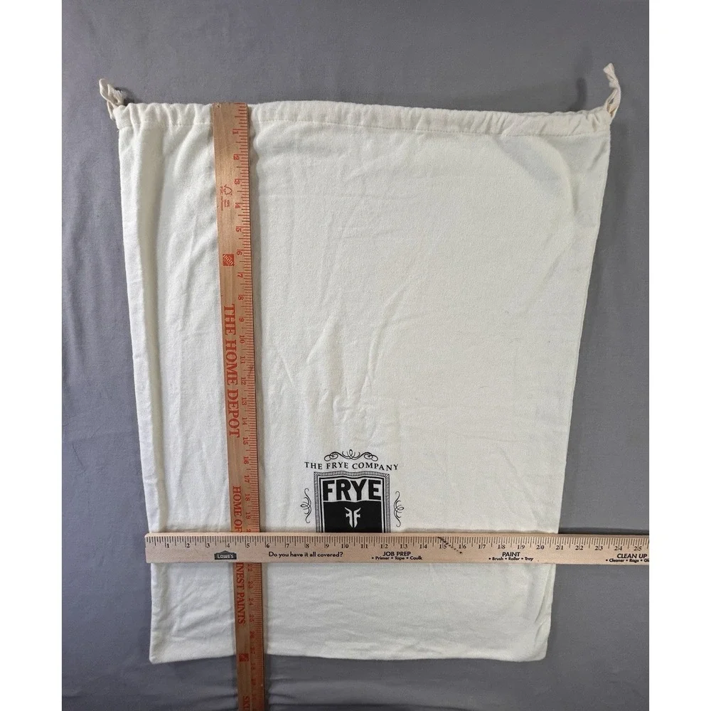 The Frye‎ Company cream-colored cotton dust bag with a drawstring closure boots